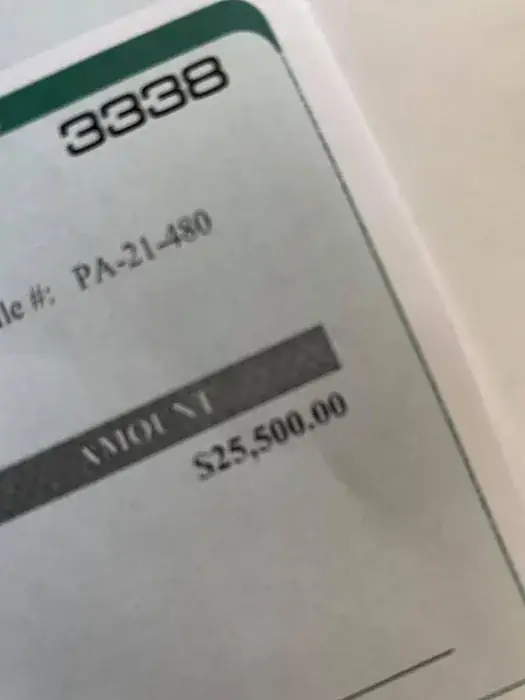 Close-up of the cheque corner: file PA-21-480, amount $25,500.00.